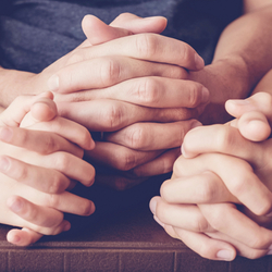 children praying with parent at home, family pray
